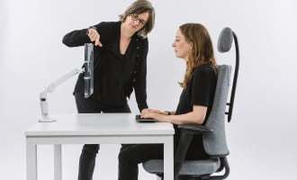 Person carrying out a workstation assessment