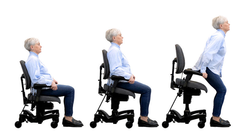 Vela Tango 700 sit to stand chair showing an adult using the chair