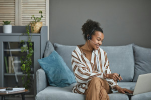 Person working at home, remote working checklist supplied by Posture People